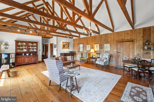 1460 Pitcock Ln, Winchester, VA 22602 - living area with high vaulted ceiling, wooden walls, hardwood / wood-style flooring, and beamed ceiling