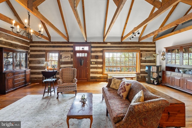 1460 Pitcock Ln, Winchester, VA 22602 - living area featuring a chandelier, wood walls, high vaulted ceiling, and beamed ceiling