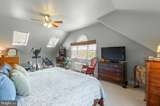 1460 Pitcock Ln, Winchester, VA 22602 - bedroom featuring carpet floors, radiator heating unit, ceiling fan, and lofted ceiling with skylight