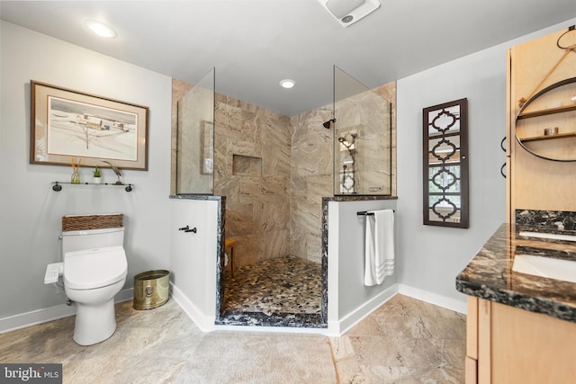 1460 Pitcock Ln, Winchester, VA 22602 - bathroom with double vanity, baseboards, walk in shower, and toilet