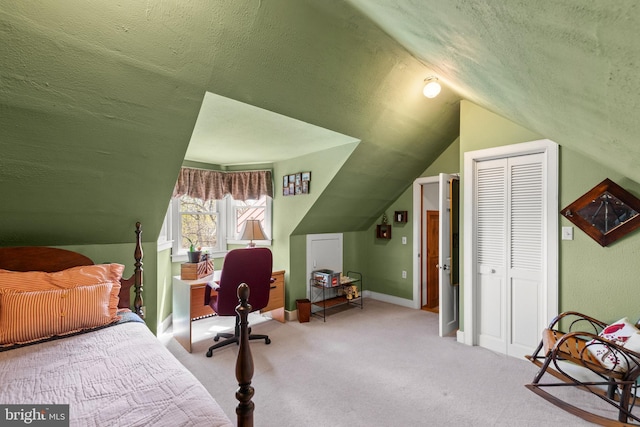 1460 Pitcock Ln, Winchester, VA 22602 - bedroom featuring baseboards, a closet, vaulted ceiling, a textured ceiling, and carpet floors