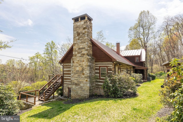 1460 Pitcock Ln, Winchester, VA 22602 - view of property exterior featuring stairway, stone siding, a chimney, and a lawn