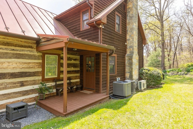 1460 Pitcock Ln, Winchester, VA 22602 - exterior space featuring a yard, a standing seam roof, and central AC