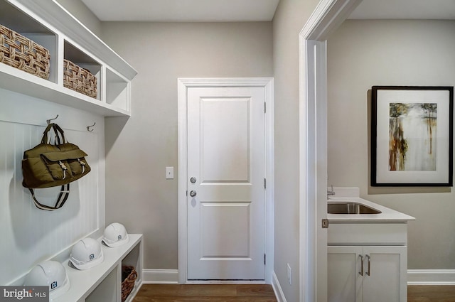 751 Bowie Shop Rd, Huntingtown, MD 20639 - mudroom with dark wood-type flooring, baseboards, and a sink
