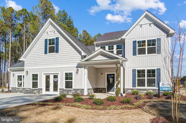 751 Bowie Shop Rd, Huntingtown, MD 20639 - modern inspired farmhouse with stone siding, french doors, and board and batten siding