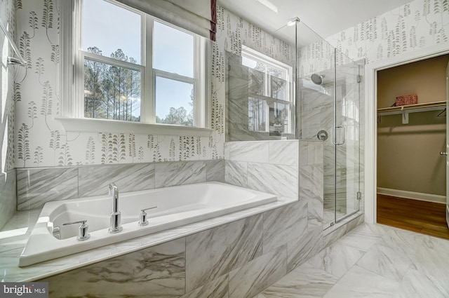 751 Bowie Shop Rd, Huntingtown, MD 20639 - full bath with marble finish floor, a shower stall, baseboards, a bath, and a spacious closet