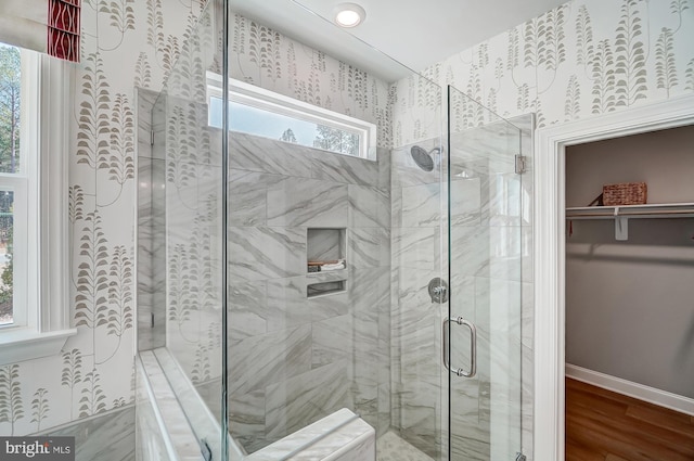 751 Bowie Shop Rd, Huntingtown, MD 20639 - full bath featuring a walk in closet, a shower stall, wood finished floors, and baseboards