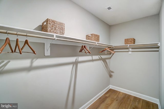 751 Bowie Shop Rd, Huntingtown, MD 20639 - spacious closet featuring visible vents and wood finished floors