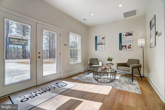 751 Bowie Shop Rd, Huntingtown, MD 20639 - living area with wood finished floors, visible vents, french doors, and baseboards