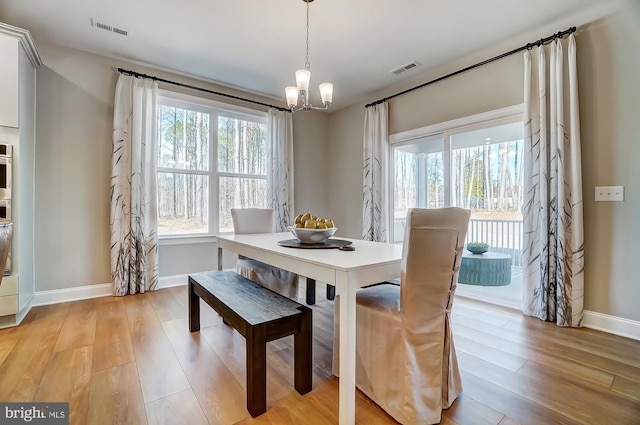 751 Bowie Shop Rd, Huntingtown, MD 20639 - dining room with baseboards, visible vents, a chandelier, and light wood-type flooring