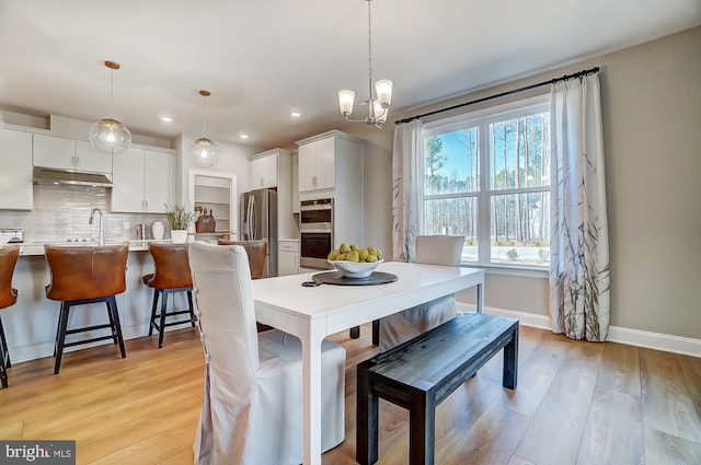 751 Bowie Shop Rd, Huntingtown, MD 20639 - dining area with recessed lighting, baseboards, light wood finished floors, and a chandelier