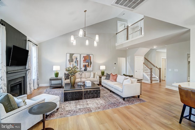 751 Bowie Shop Rd, Huntingtown, MD 20639 - living area with visible vents, light wood-style flooring, and stairway