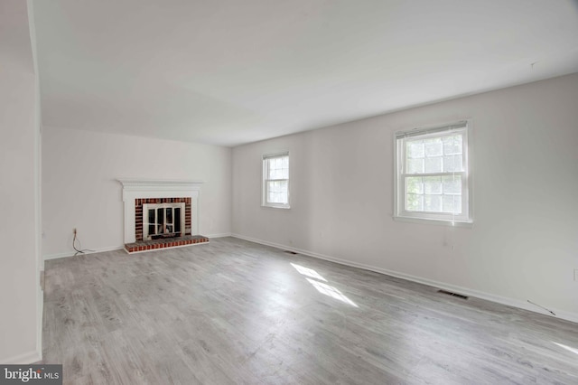 14613 Tynewick Ter Unit 6-1461, Silver Spring, MD 20906 - unfurnished living room with baseboards, a fireplace, visible vents, and wood finished floors