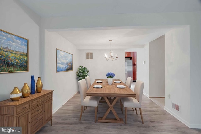 14613 Tynewick Ter Unit 6-1461, Silver Spring, MD 20906 - dining room featuring a chandelier, baseboards, visible vents, and wood finished floors