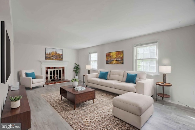 14613 Tynewick Ter Unit 6-1461, Silver Spring, MD 20906 - living room featuring wood finished floors and a brick fireplace
