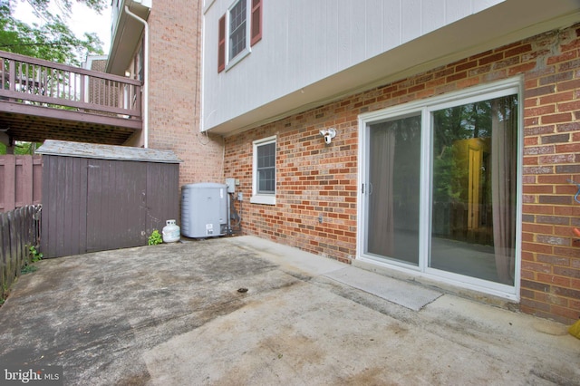 14613 Tynewick Ter Unit 6-1461, Silver Spring, MD 20906 - view of patio with fence, a storage shed, and an outbuilding