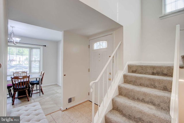 14613 Tynewick Ter Unit 6-1461, Silver Spring, MD 20906 - staircase with a healthy amount of sunlight, a notable chandelier, baseboards, and visible vents