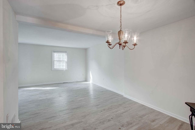 14613 Tynewick Ter Unit 6-1461, Silver Spring, MD 20906 - empty room with an inviting chandelier, wood finished floors, and baseboards