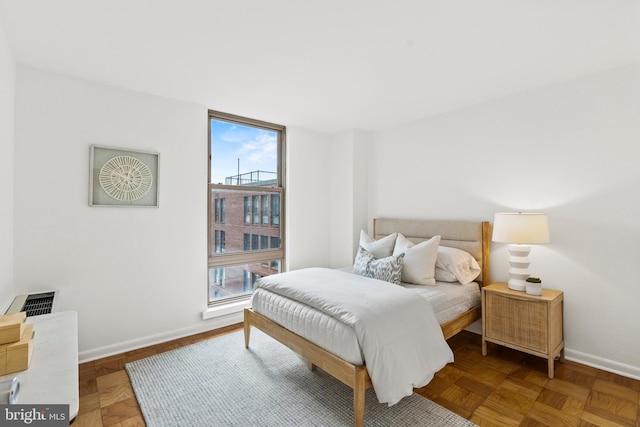 1260 21st St NW Unit 911, Washington, DC 20036 - bedroom with multiple windows and baseboards