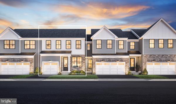 107 Mahogany Ln, King Of Prussia, PA 19406 - townhome / multi-family property with stone siding, driveway, board and batten siding, and an attached garage