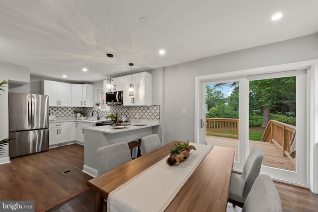6611 Loch Hill Rd, Baltimore, MD 21239 - dining space featuring recessed lighting and dark wood-style floors