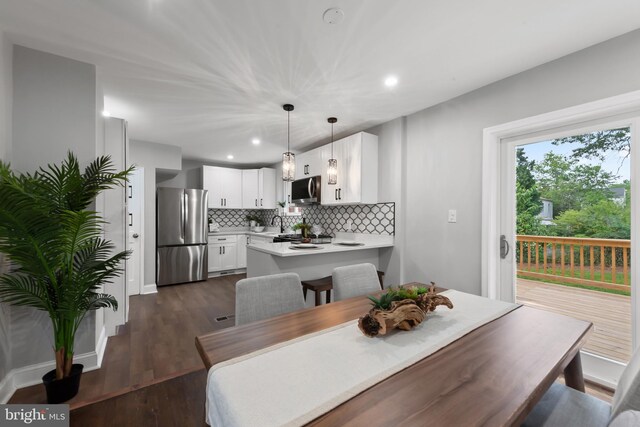 6611 Loch Hill Rd, Baltimore, MD 21239 - dining room with recessed lighting and dark wood-type flooring
