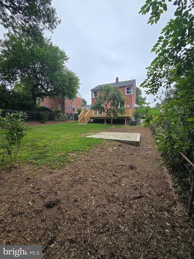 6611 Loch Hill Rd, Baltimore, MD 21239 - view of yard featuring a wooden deck and stairway