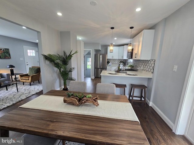 6611 Loch Hill Rd, Baltimore, MD 21239 - dining space with dark wood-type flooring and recessed lighting