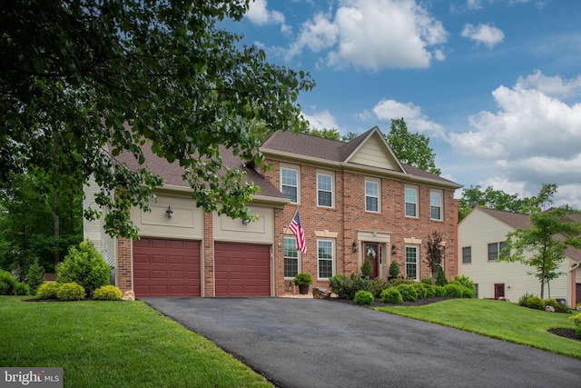 47 Christopher Way, Stafford, VA 22554 - view of front of house featuring brick siding, asphalt driveway, a front lawn, a shingled roof, and a garage