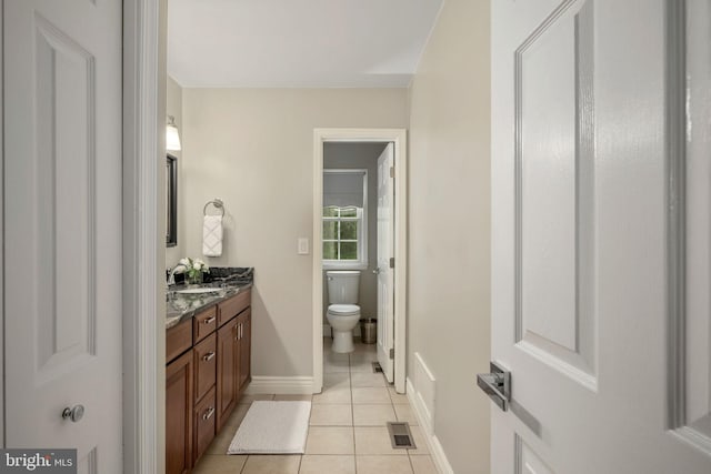 47 Christopher Way, Stafford, VA 22554 - bathroom with tile patterned floors, toilet, vanity, and baseboards