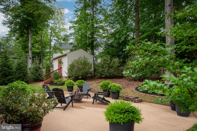 47 Christopher Way, Stafford, VA 22554 - view of patio / terrace featuring an outdoor fire pit, an outdoor structure, and fence