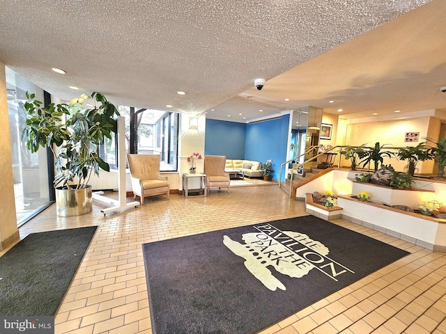 5340 Holmes Run Pkwy Unit 1410, Alexandria, VA 22304 - common area featuring a textured ceiling, a security system, stairway, and recessed lighting