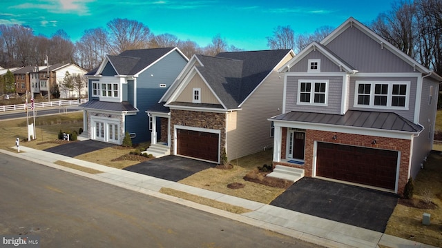126 Sadie Way, Arnold, MD 21012 - view of front of home featuring an attached garage, brick siding, french doors, a standing seam roof, and driveway