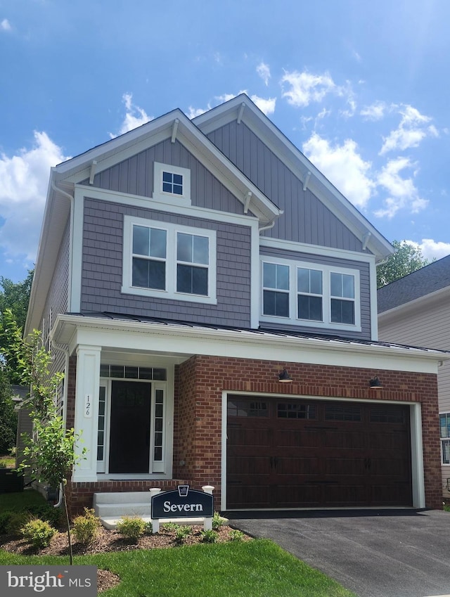 126 Sadie Way, Arnold, MD 21012 - craftsman-style home featuring brick siding, a garage, board and batten siding, and driveway