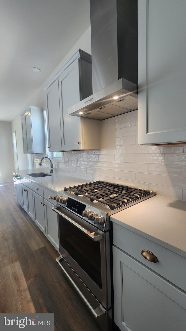 126 Sadie Way, Arnold, MD 21012 - kitchen featuring stainless steel range, a sink, wall chimney exhaust hood, dark wood-type flooring, and backsplash