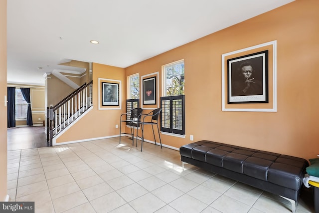 interior space with recessed lighting, baseboards, tile patterned flooring, and stairs