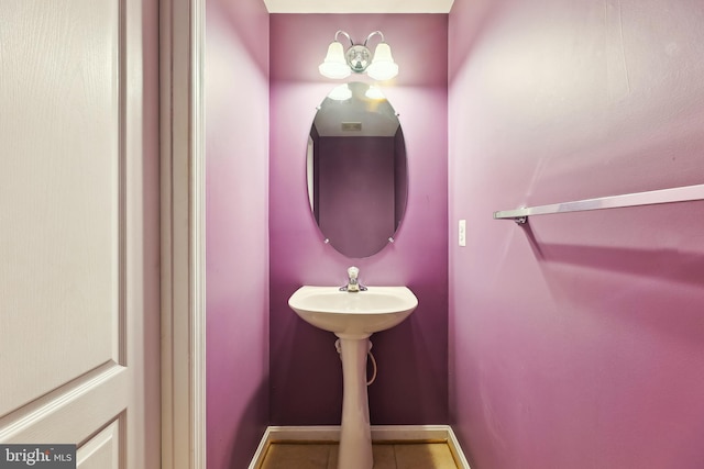 bathroom featuring tile patterned floors and baseboards