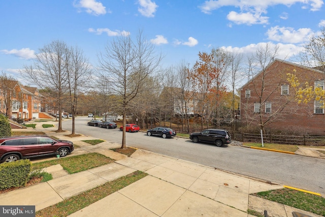 view of road with curbs and sidewalks