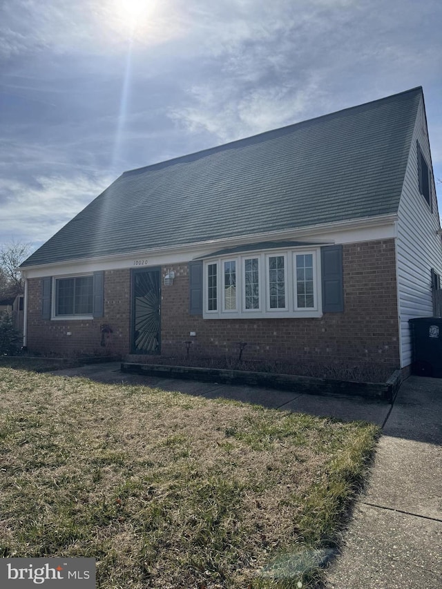 10020 Dakin Ct, Cheltenham, MD 20623 - view of front facade featuring brick siding and a front lawn