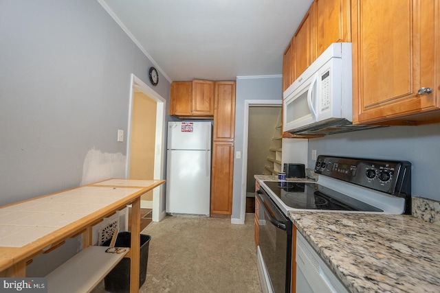 1405 Siegel Ave, Chester, PA 19013 - kitchen with ornamental molding, light countertops, brown cabinetry, and white appliances