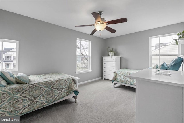 bedroom with baseboards, light carpet, and ceiling fan