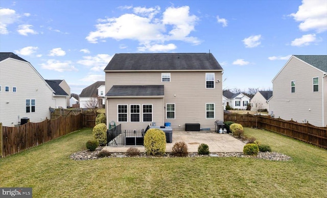 back of house with a residential view, a patio, a lawn, and a fenced backyard