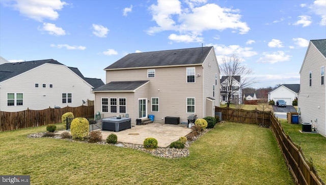 rear view of house with central AC, a patio area, a lawn, and a fenced backyard