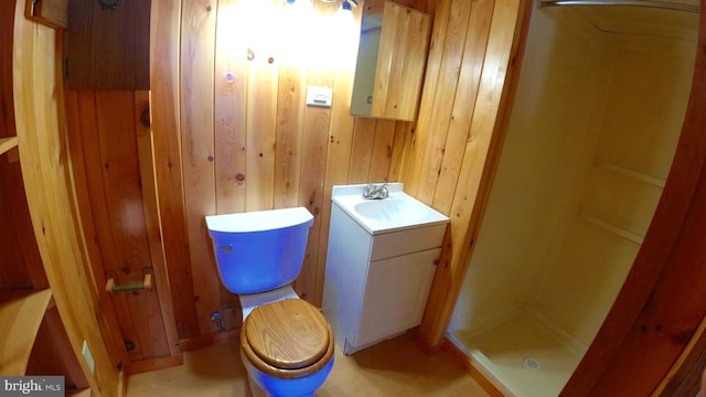 8354 Cumberland Rd, Springfield, WV 26763 - full bath with a shower stall, wooden walls, toilet, and vanity