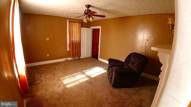 8354 Cumberland Rd, Springfield, WV 26763 - sitting room with a ceiling fan, carpet floors, baseboards, and wooden walls