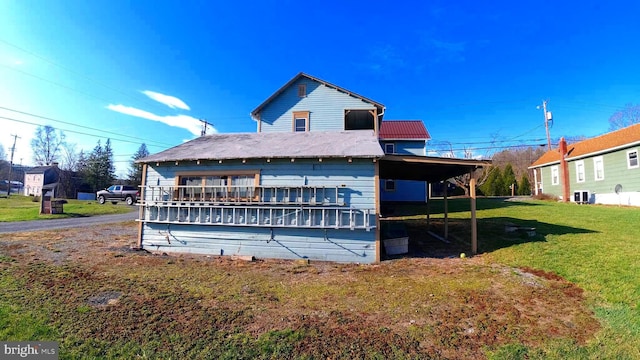 8354 Cumberland Rd, Springfield, WV 26763 - back of house with central AC unit, a lawn, and metal roof