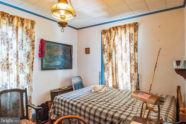 bedroom with ornamental molding