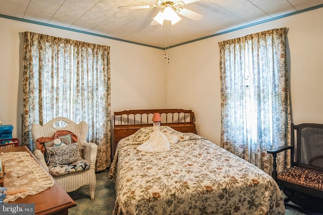 carpeted bedroom featuring ceiling fan