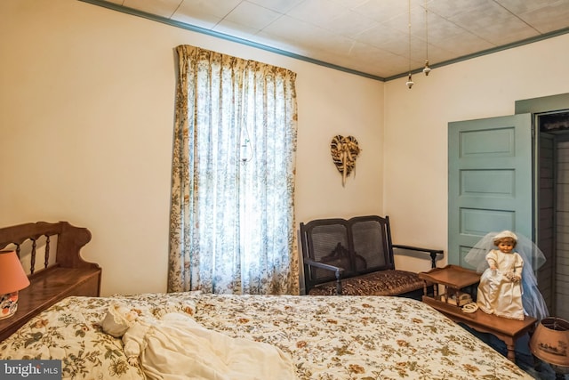 bedroom with ornamental molding
