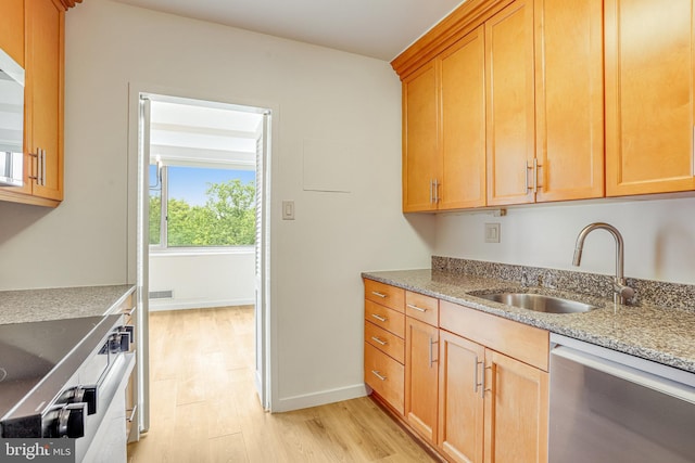 4101 Cathedral Ave NW Unit 1104, Washington, DC 20016 - kitchen with dishwasher, light wood-style floors, a sink, and light stone counters